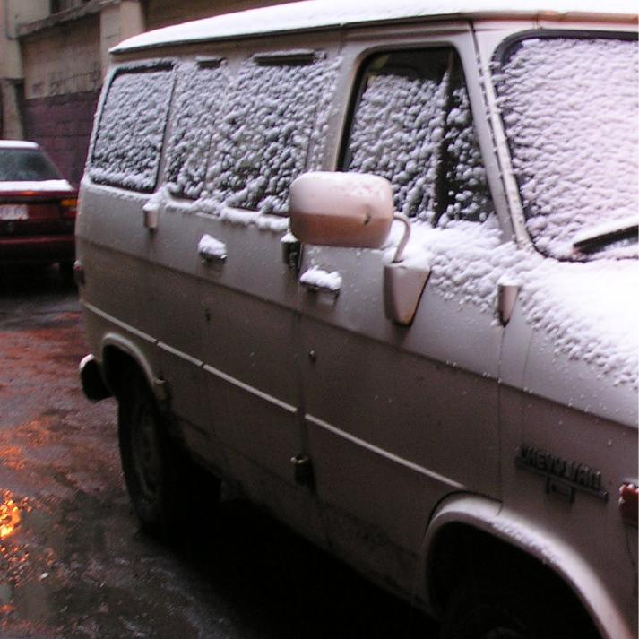 Snow-covered van